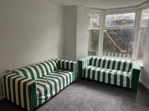 Bright lounge area with stylish striped seating...