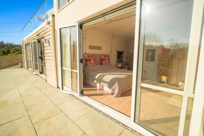REAR PATIO TO BEDROOM