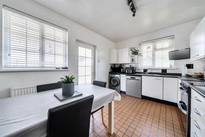 Kitchen with large windows allowing natural light