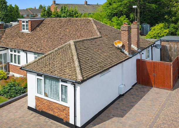 Suburban house with red brick accents.png