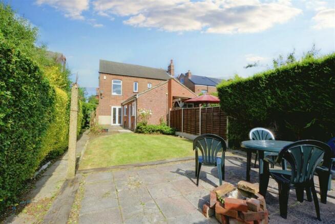 Sunny private rear garden with lawn, paved pati...