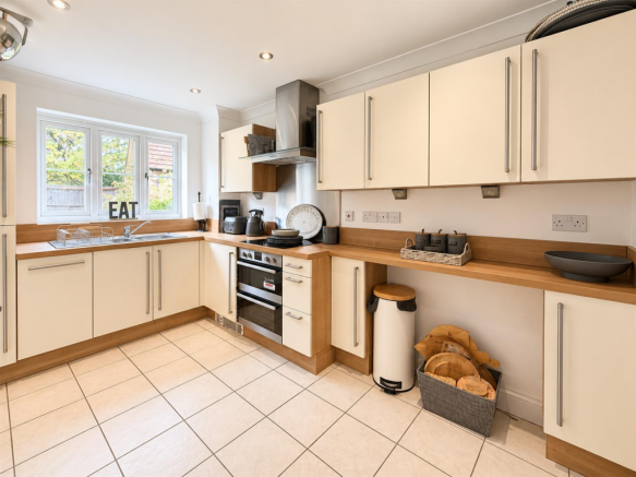 Bright Modern Kitchen with EAT Sign.png