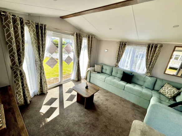 Spacious Living Area with Patio Doors in the Wille