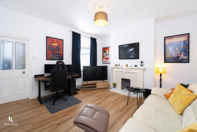 Modern living room with gaming setup.png