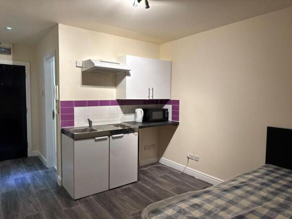 A compact but functional kitchen featuring a sm...