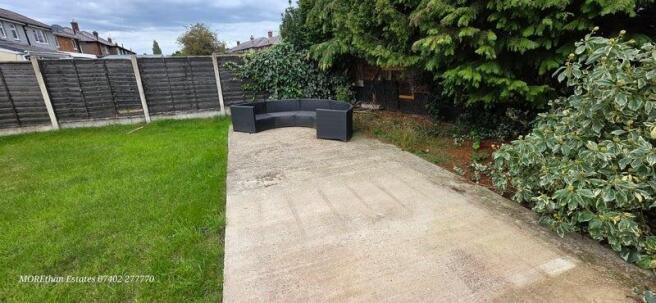 Private rear garden with lawn and patio seating...