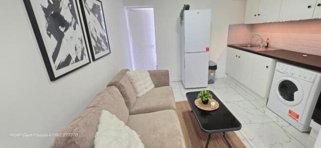 Bright open plan kitchen with sleek modern unit...