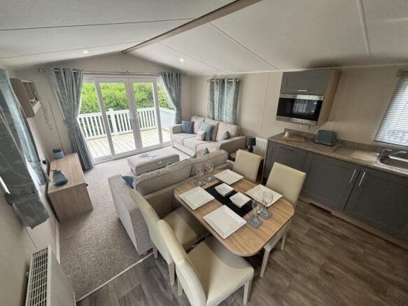 Open Plan Lounge, Dining Area And Kitchen In The W