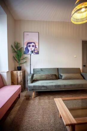 Stylish lounge with comfy sofas and soft lighti...