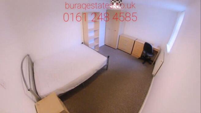 Bright bedroom with ample storage and desk spac...