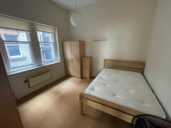 Bright double bedroom with ample storage space...