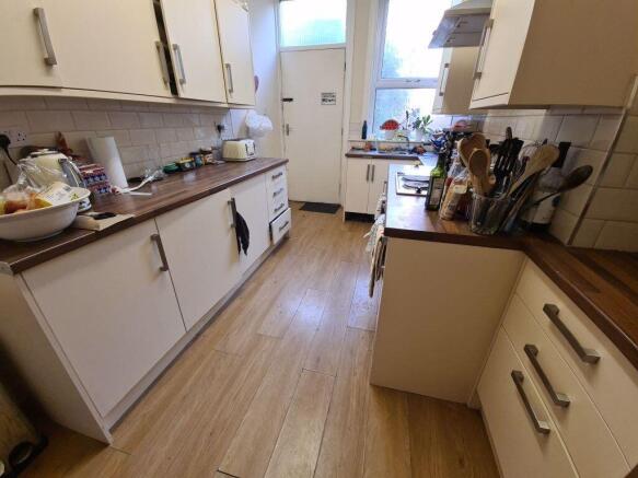 A cozy and functional kitchen with ample counte...