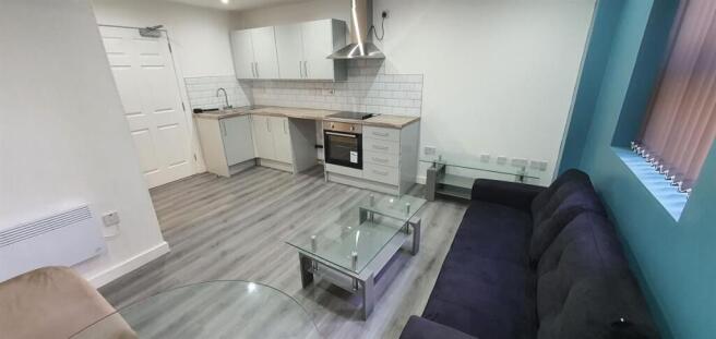 Contemporary open-plan living space with a comp...