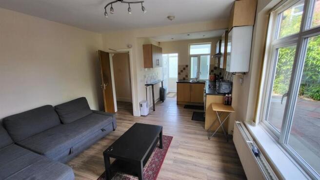 Bright, modern living room with a large window,...