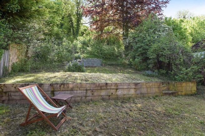Private woodland to rear garden