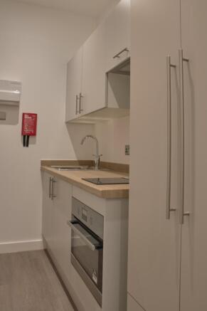 A modern and clean kitchenette featuring sleek ...