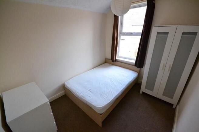 Cozy bedroom with double bed and ample storage...