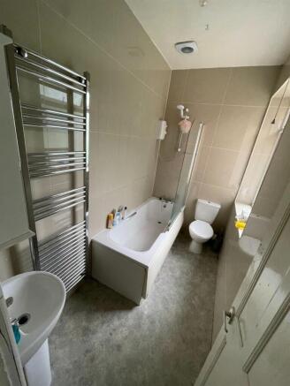 A clean and well-maintained bathroom featuring ...