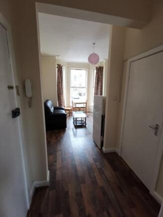 Bright living area with classic bay windows...