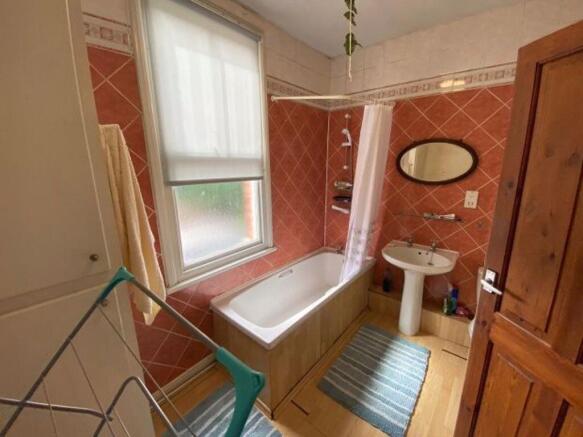 A clean and well-maintained bathroom featuring ...