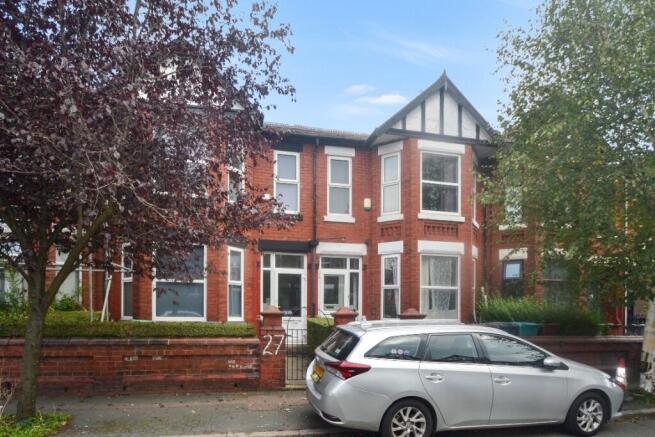 Exterior view of a charming red-brick property ...