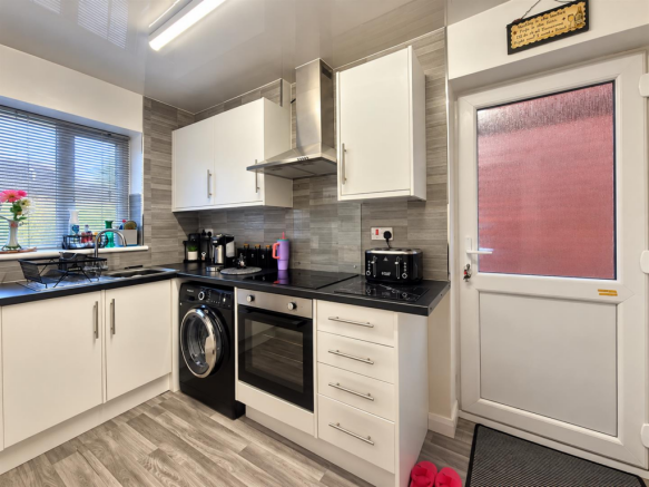 Modern Grey and White Kitchen Interior.png