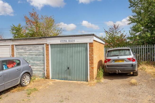 Garage En Bloc & Parking Space To Rear