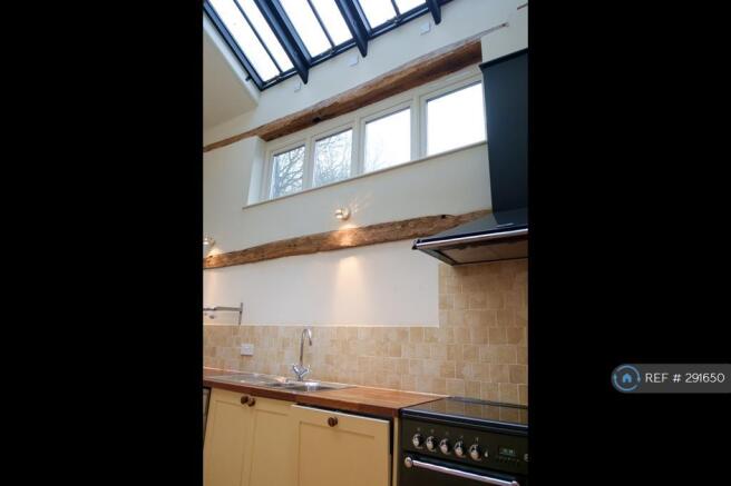Kitchen Showing Double Height Ceiling
