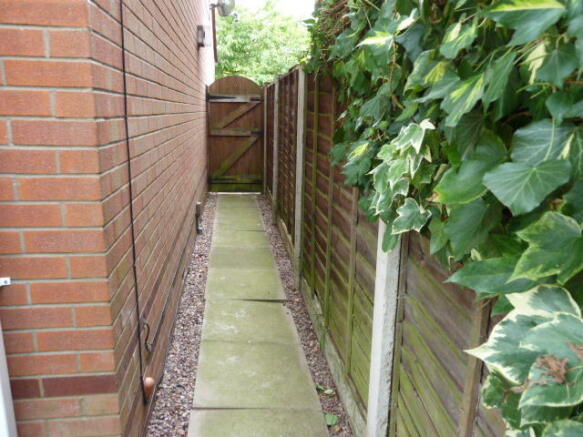Gated access pathways to both sides of the property
