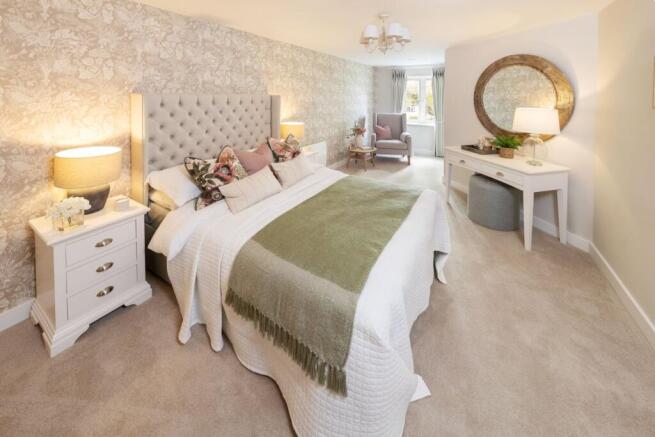 a bedroom with a bed and a mirror