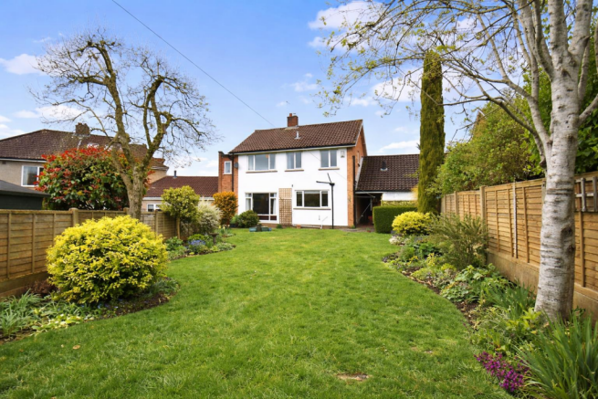 Sunny suburban garden and house.png