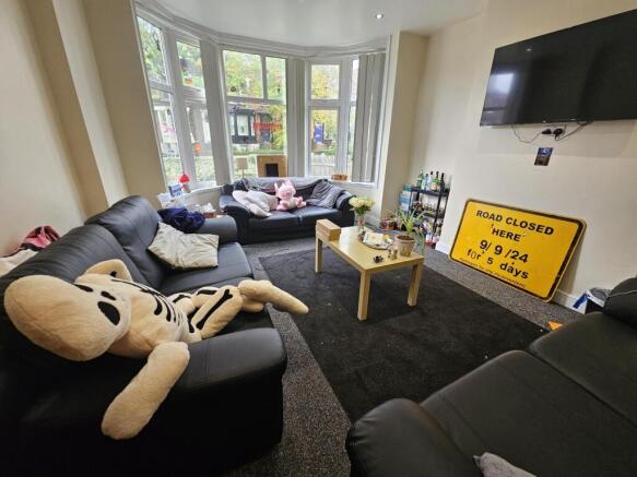 Bright and welcoming living room featuring comf...