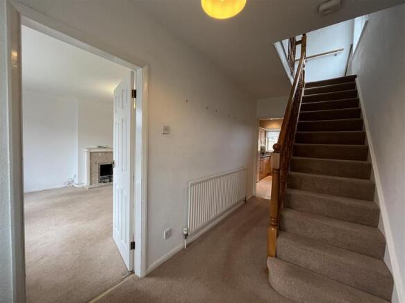 Stairs lead to first floor