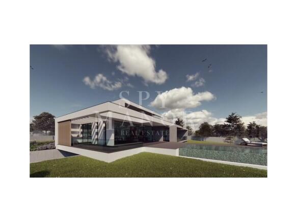 Contemporary luxury villa in Carvoeiro, Algarve, featuring modern architectural design, extensive floor-to-ceiling glazing, private swimming pool, and landscaped outdoor gardens.