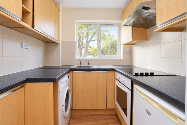 Bright Neutral Galley Kitchen with Garden View.png
