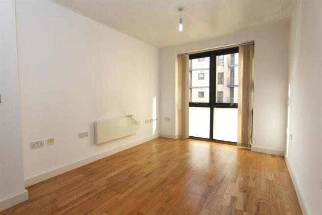 Bright modern living area with wooden floors...