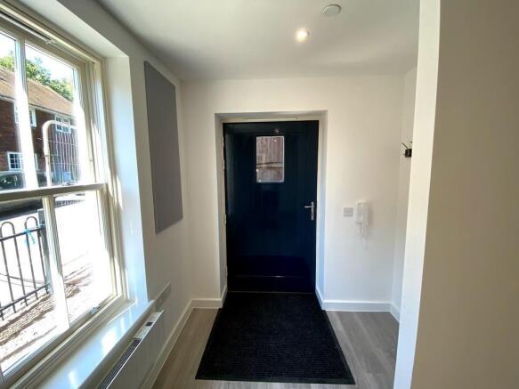 Bright and modern entrance with large window...