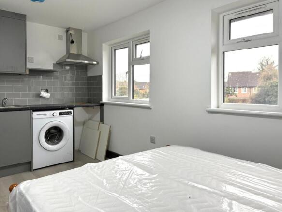 Bright, tidy single bedroom with neutral decor,...