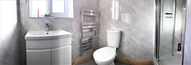 A modern bathroom featuring a sleek vanity, a s...