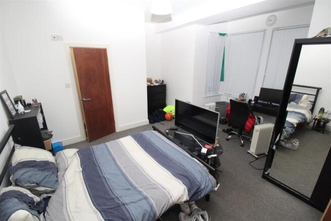 Spacious bedroom with double bed and desk space...