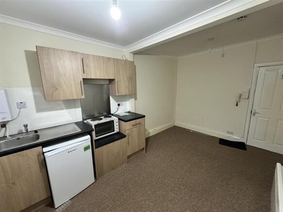 Bright kitchen with ample workspace and storage...