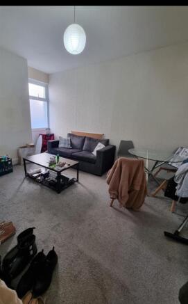 Spacious lounge with comfy sofa and dining area...