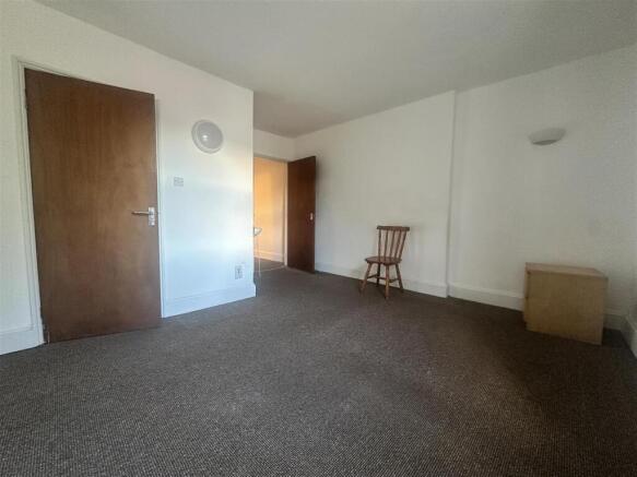 Bright and spacious double bedroom with carpet...
