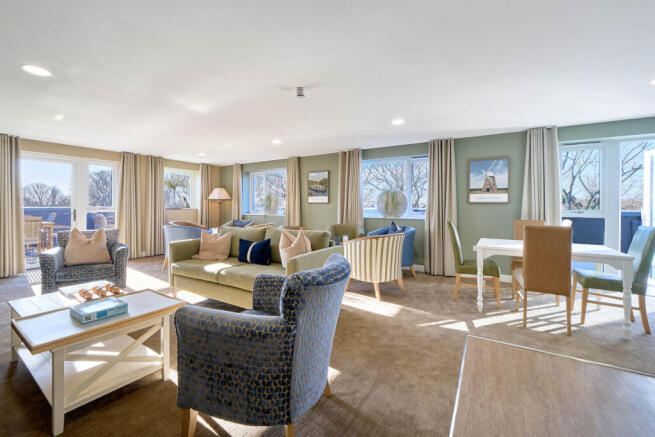 a large living room with a large window
