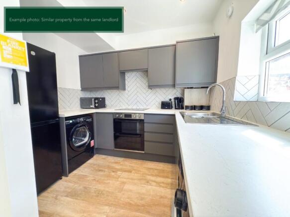 Modern kitchen with sleek grey cabinetry....