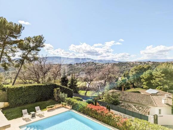 Swimming pool with sun deck and Mougins hillside v