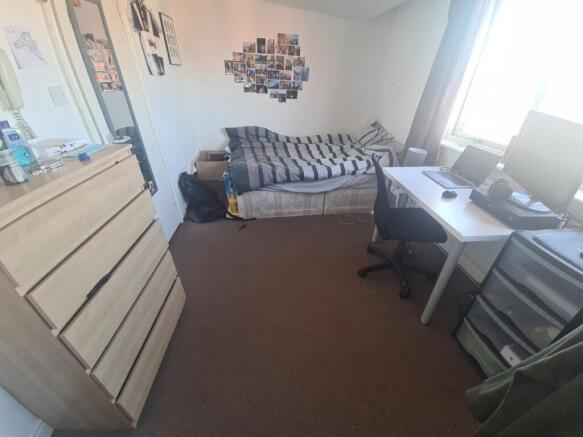 A well-sized, inviting living room featuring a ...