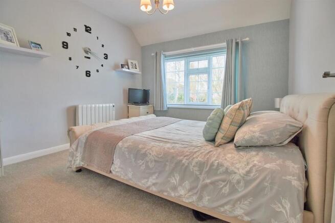 BEDROOM ONE TO FRONT