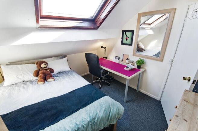 Bright, cosy double bedroom in a loft space wit...