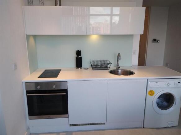 Modern gloss kitchen with integrated appliances...